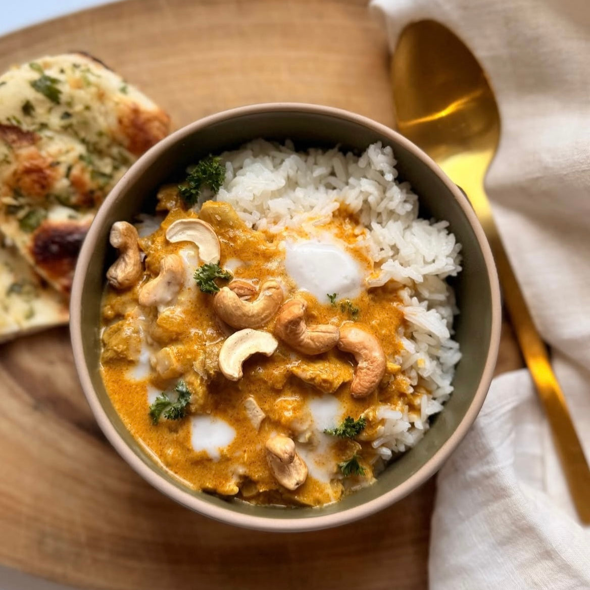coconut butter chicken plated and garnished