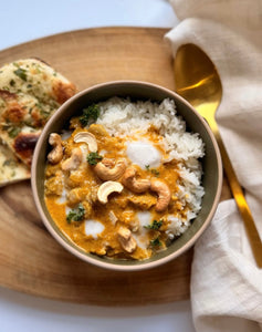 coconut butter chicken plated and garnished